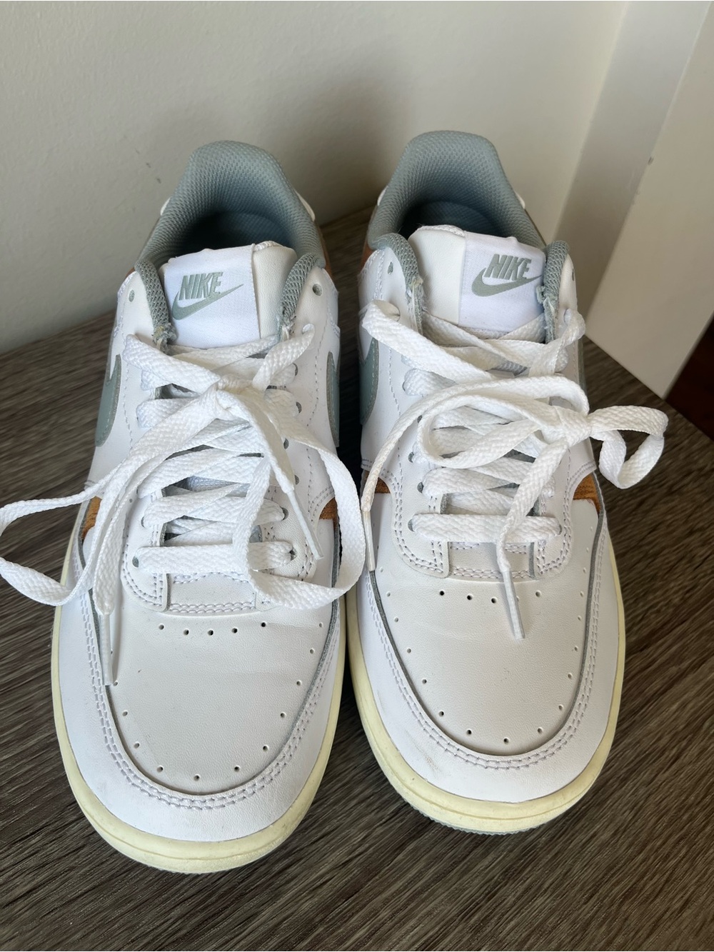 Nike Women White Sneakers with Light blue and orange Accents